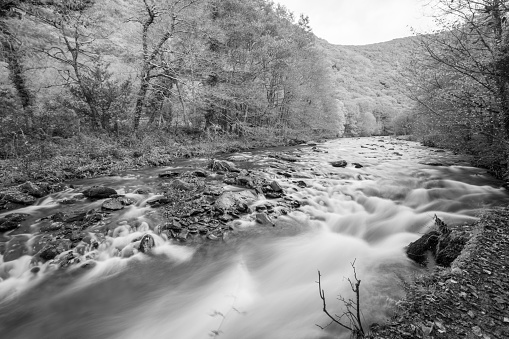 Long exposure of the East Lyn River flowing through the Doone Valley at Watersmeet in Exmoor National Park