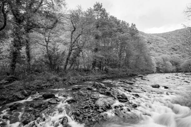 Caban Coch Dam in the Elan Valley as rays of light break through the cloud creating some very dramatic lighting.