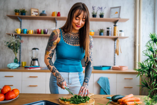 istock Woman making healthy vegetable meal 1354488947
