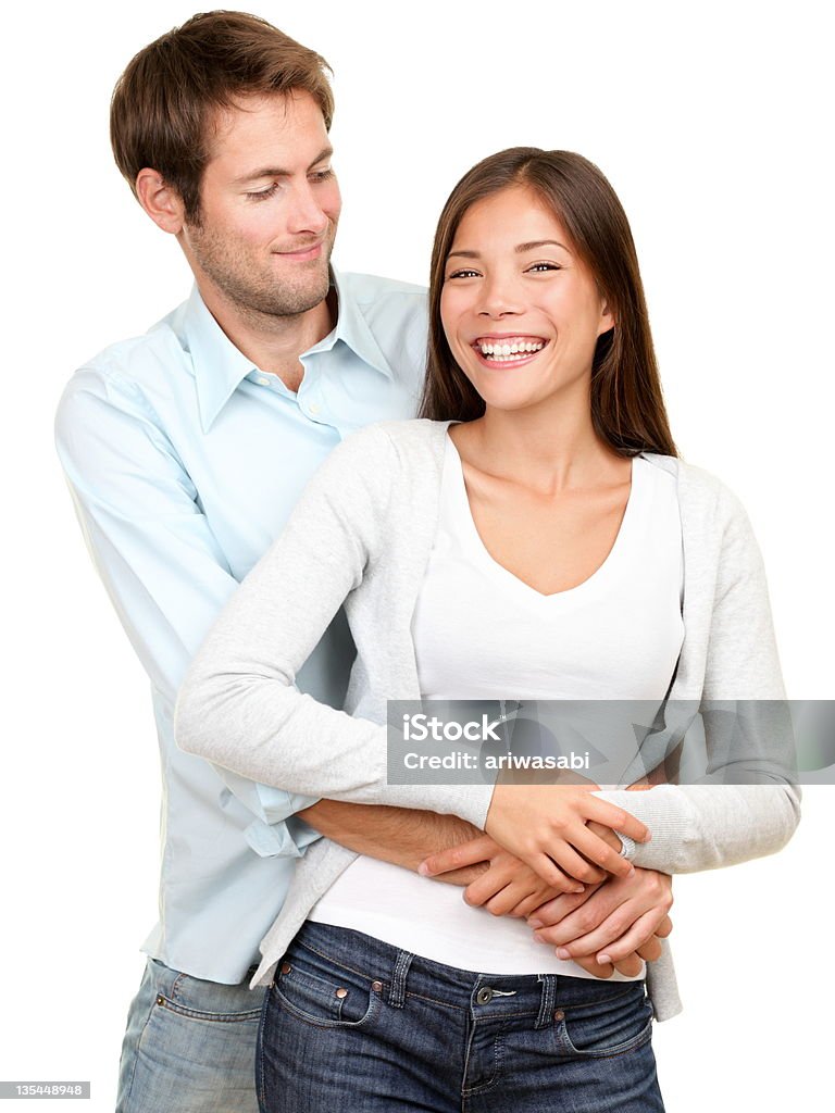 Young couple young couple smiling happy. Interracial couple, Asian woman, Caucasian man isolated on white background. Adult Stock Photo