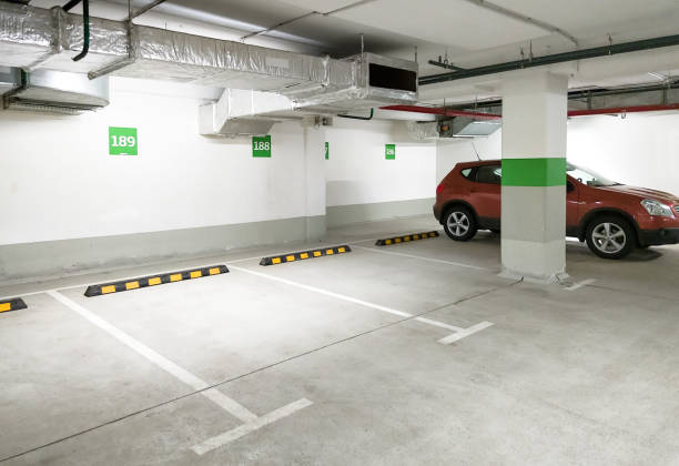 Underground car parking, empty modern parking lot indoor stock photo