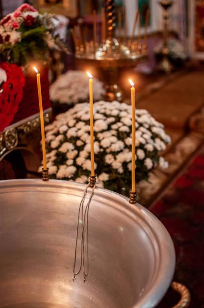 istock fire candles near the silver bowl with water 1354493437