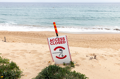 Access Closed, warning sign on beach, background with copy space, full frame horizontal composition