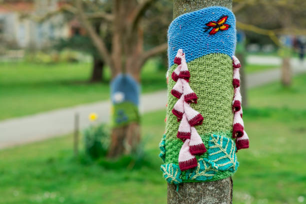 Close up wool sweater jacket for tree in winter time in UK park