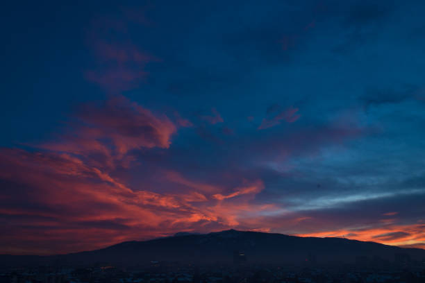 Golden and purple colors variegate the twilight sky after sunset