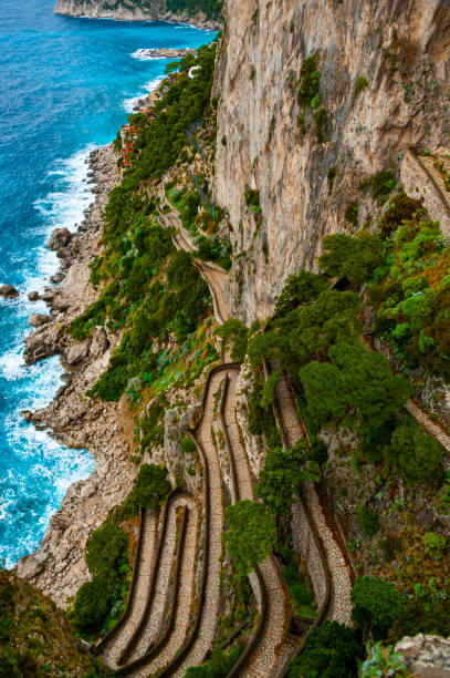 Via Krupp Via Krupp on the island of Capri, built in 1904, is one of the most beautiful paths in the world via krupp stock pictures, royalty-free photos & images