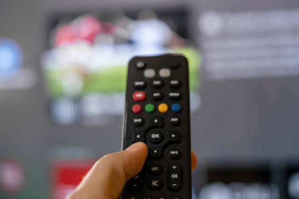 istock Man hand browse smart tv apps,zapping channels on leisure lockdown time,home lifestyle 1354514695