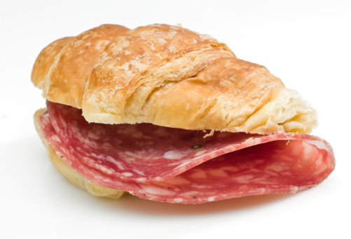 Salami mini croissant sandwich on white background (this picture has been taken with a Hasselblad H3D II 31 megapixels camera)