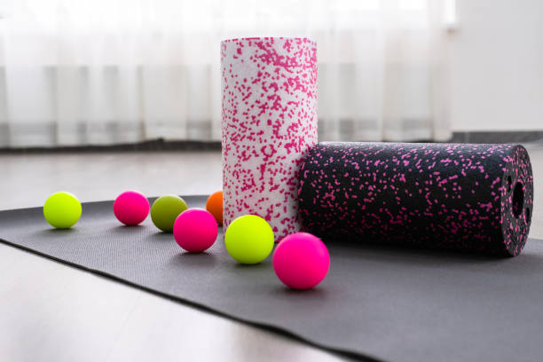 Colored Myofascial release massage balls, roll and other body roll recover on gray mat massage balls, roll and other body roll recover. Concept of Myofascial release physiotherapy roller ball stock pictures, royalty-free photos & images