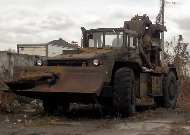 istock Military engineering earthmoving machine on wheels with trenching bucket 1354520622