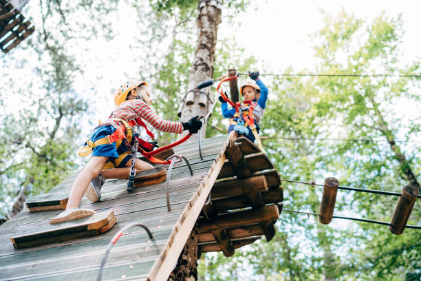 istock Boy climbing a climbing wall by rearranging carabiners 1354520709