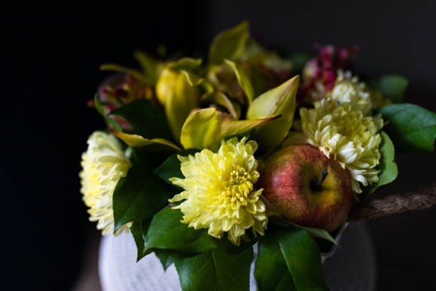 Bouquet of yellow chrysanthemums with apple, fresh flowers, artificial apple.