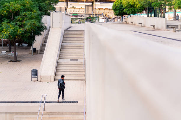 istock young latin student walking around the city 1354523715