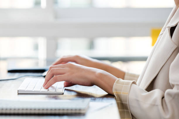 istock Office working woman hands typing on computer keyboard on the table 1354524910