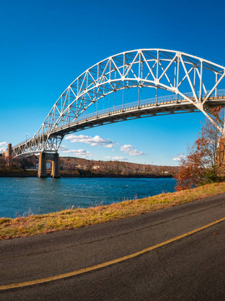 istock Sagamore Bridge and paved bike ways along the Cape Cod Canal. 1354526032