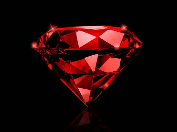 Photo of Dazzling diamond red gemstones on black background