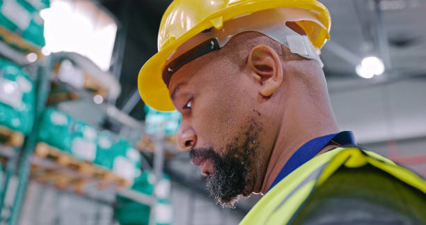 istock Low angle shot of a mature man working in a warehouse 1354533626