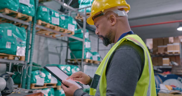 istock Shot of a mature man using a digital tablet while working in a warehouse 1354533649