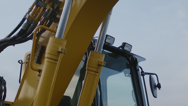 yellow excavator on construction site close up heavy hydraulic equipment