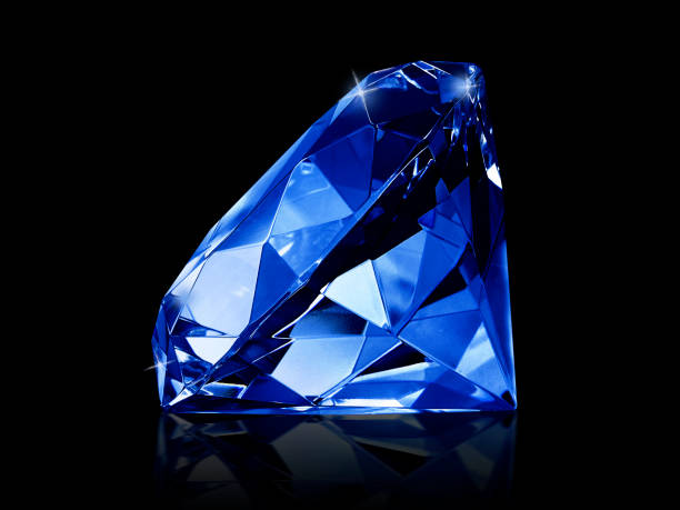 istock Dazzling diamond Blue gemstones on black background 1354539634