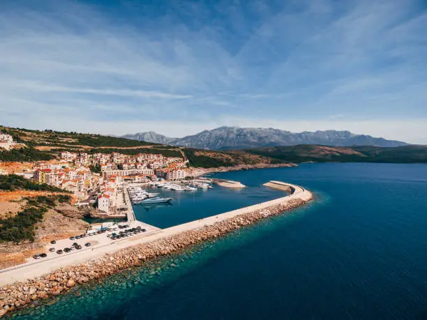 Photo of View from the sea to beautiful houses in the Lustica Bay. Montenegro