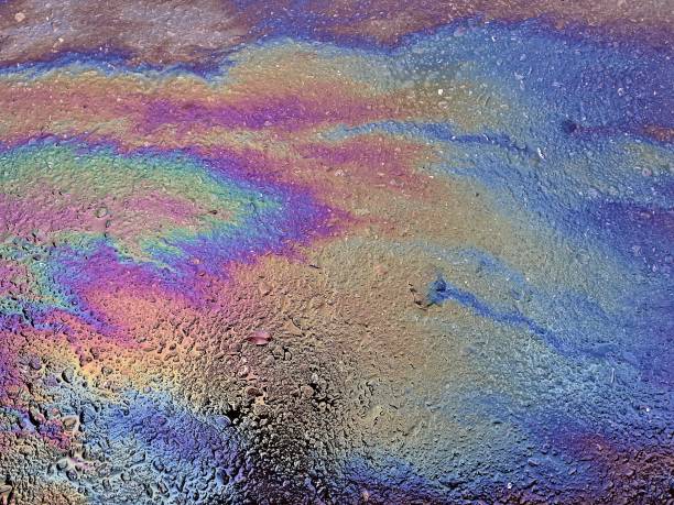 istock Eco concept, oil spill on asphalt road 1354541524