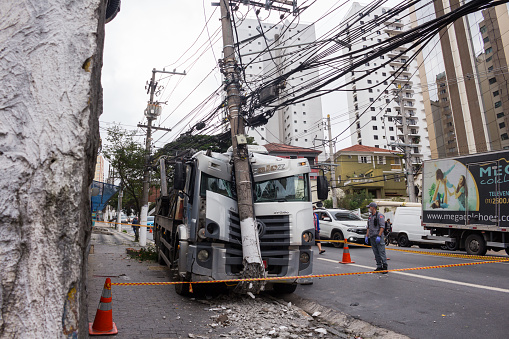 São Paulo, SP, Brasil - June 11, 2021: Power pole broken by the shock of a truck without a brake, fortunately without a casualty.