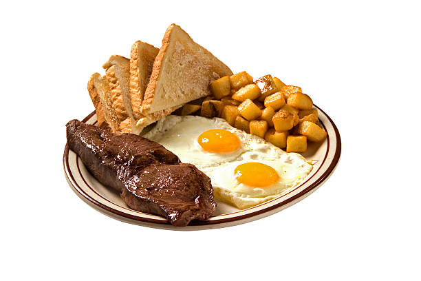 Steak and eggs Steak and egg breakfast plate with home fries and toast steak and eggs breakfast stock pictures, royalty-free photos & images