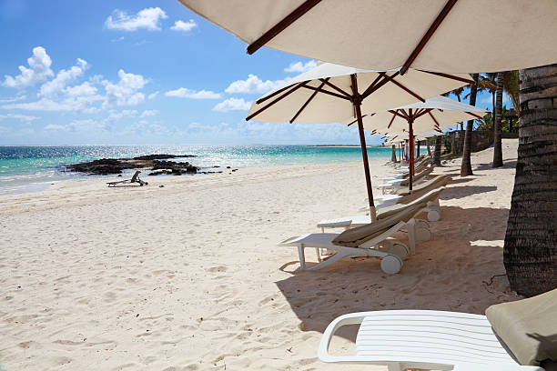 istock Mauritius resort beach with umbrellas and chairs 135455144