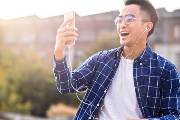istock Excited young man watching the  mobile phone 1354551462