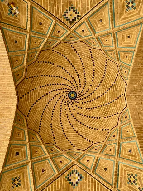 The elaborate geometrical patterns on the Vakil Mosque ceiling