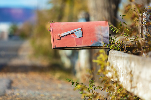 Mailing and Postage Delivery Written Communication Red Retro Postal Mailbox on Rural Road Matching 4K Video Available (Photos professionally retouched - Lightroom / Photoshop - downsampled as needed for clarity and select focus used for dramatic effect)