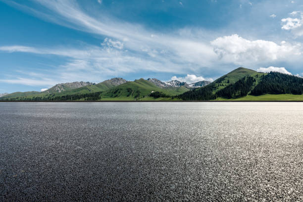 istock Asphalt highway and mountain under blue sky 1354559481