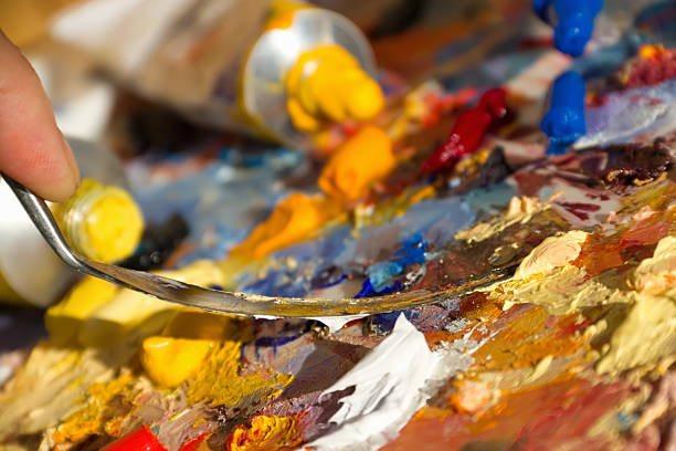 istock mixing oil paints with a brush 135455979