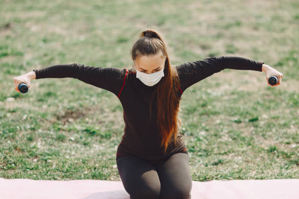 istock Cute girl doing yoga in a summer park 1354561149