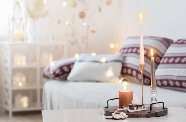 istock christmas home decorations with candles in white interior 1354561424