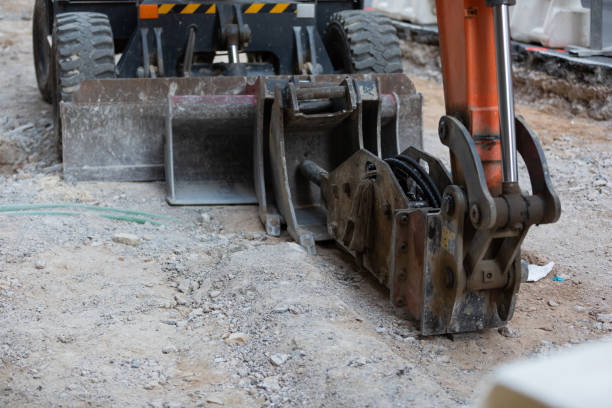 istock Excavator on urban street 1354562341