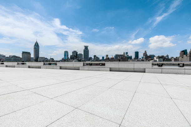 istock Panoramic skyline and modern commercial buildings with empty road. 1354564051