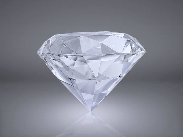istock Shiny brilliant diamond placed on gray background 1354568634