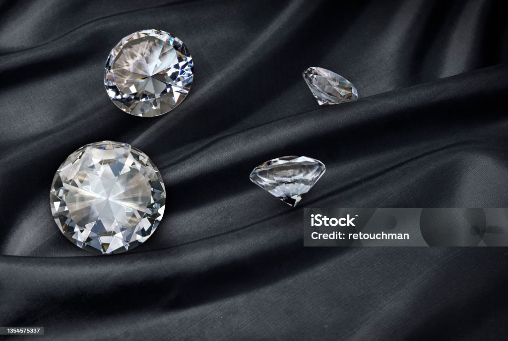 diamond on black fabric background Diamond - Gemstone Stock Photo