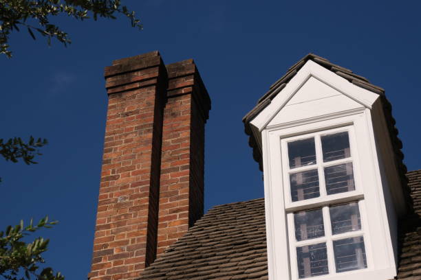 istock Vintage buildings displaying their chimneys 1354576309