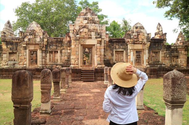 Female Traveler Visiting Prasat Sdok Kok Thom Khmer Temple, Archaeological Site in Sa Kaeo Province, Thailand Female Traveler Visiting Prasat Sdok Kok Thom Khmer Temple, Archaeological Site in Sa Kaeo Province, Thailand, ( Self Portrait ) khmer stock pictures, royalty-free photos & images