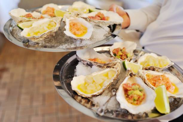 istock Baked mussels with cheese, cilantro and lemon in oyster shells 1354580798