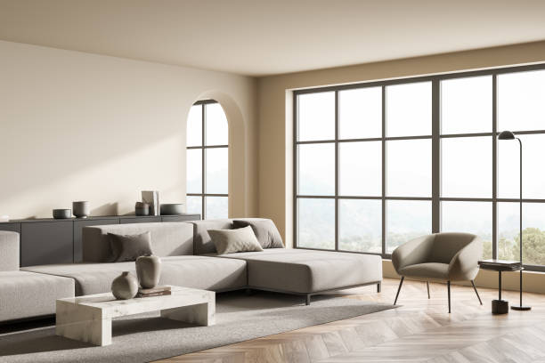 istock Modern panoramic beige living room with arch doorway. Corner view. 1354583691