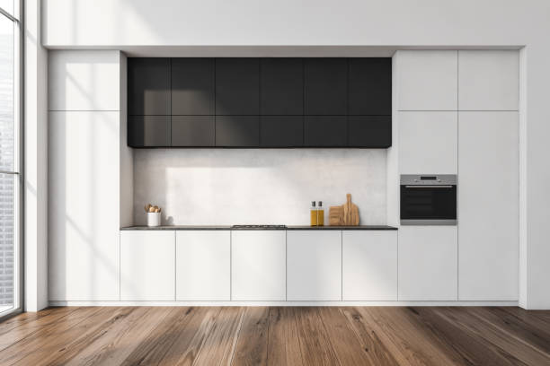 istock White kitchen interior with shelves and appliances near window, parquet floor 1354584130