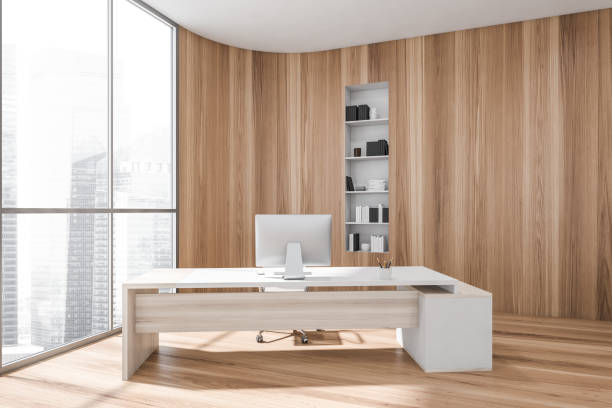 istock Wooden consulting room interior with table and computer near window. Copy space 1354585664