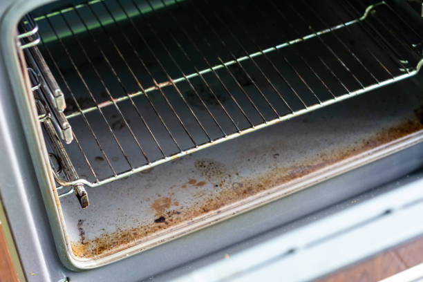 istock Dirty kitchen oven after cooking. The oven is greasy and stained 1354587554