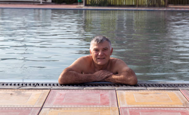 istock A man is relaxing in an open-air pool with thermal water. 1354588292
