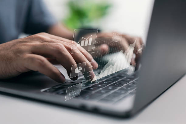 istock The concept of big data analytics and business intelligence. On a virtual screen, there are financial charts. 1354589514