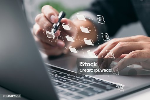 istock To successfully handle files, IT personnel uses a Document Management System (DMS), an online documentation database, and process automation, as well as other corporate business technologies. 1354589551